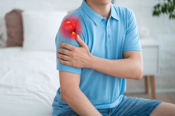 Physiotherapist helping a patient with shoulder movement exercises at JOSPT Clinic, Nagercoil